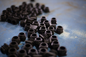 Rubber caps are scattered on the table. 