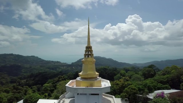 Circeling a buddha temple spier at koh samui island Thailand - Drone footage in 4k resolution