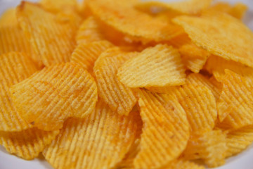 Potato chips are very to eat.