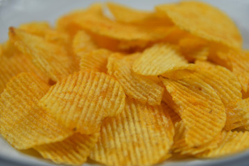 Potato chips are very to eat.