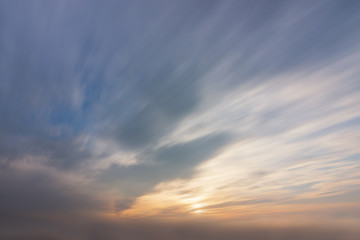 Obraz premium Sky, sun and clouds with ray light during sunset time. Long exposure nature background ..