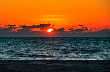 Fototapeta premium sunset on the sea, sea, sun, red, orange, clouds, beach, horizon, waves, landscape, dusk, evening