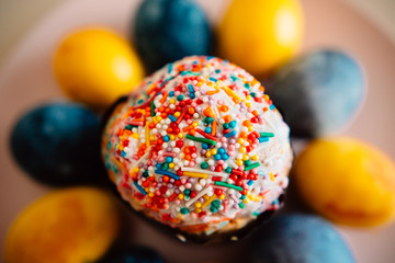 colored eggs and Easter cake on a plate