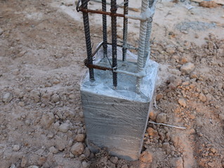 Concrete and steel column foundation.