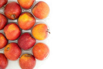 Fresh red apples close up on white background with copy space, view from above
