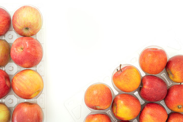 Fresh red apples close up on white background with copy space, view from above