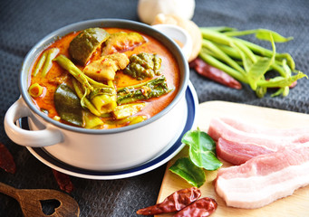 Thai streaky pork red curry with morning glory (Thai name is Kaeng Thepho). Thai red curry soup with fresh ingredient.