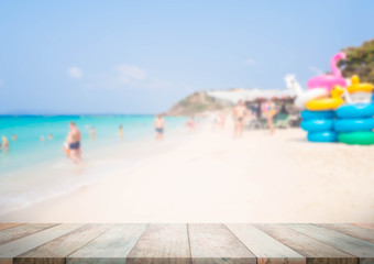 Wood perspective on blue sea and beach blur image background. wood table top on blurred blue sea. thai sea concept.