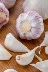 fresh  garlic heads and cloves close-up on  wood background