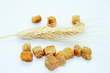 Salted rye crackers and rye earare are located on a white background