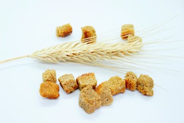 Salted rye crackers and rye earare are located on a white background