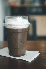 Cold refreshing coffee mocha mix dark chocolate topping with milk froth