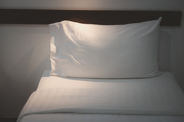 White bedding and pillow in hotel room