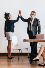 Obraz premium Successful businesspeople doing a high five