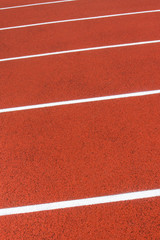 Red treadmill at stadium. Healthy and sporty lifestyles concept