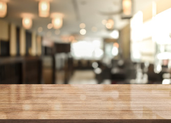3D Rendering, Wooden top table with bokeh light effect and blur restaurant on background, blur background