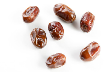 Close-Up Of Dates Over White Background