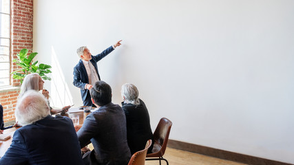 Successful senior businessman in a meeting