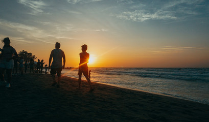 Fototapeta premium people walking on the beach