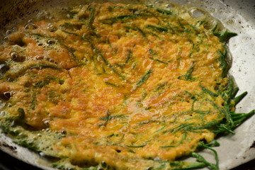 Cha-om khai or acacia omelette Thai food.