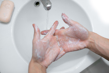 Washing hands rubbing with soap man for corona virus prevention, hygiene to stop spreading...