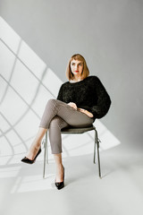Model posing in a natural light studio