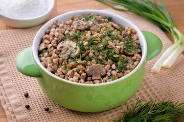 Buckwheat porridge with mushrooms, traditional russian food. Horizontal orientation