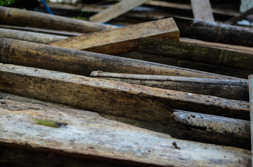 Piles of abandoned weathered wood. Selective focus