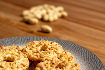 sable biscuits with chopped peanuts on top