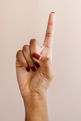 Woman's hand showing number one