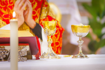 chalice with wine, blood of christ, and pyx with bread, body of christ, ready for the communion of the faithful