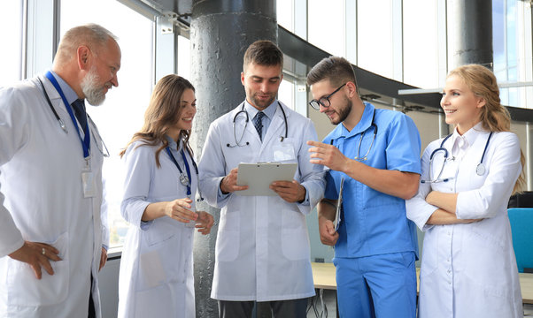 Group of doctors standing at the medical office.
