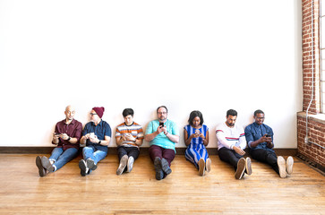 Fototapeta premium People sitting on the floor