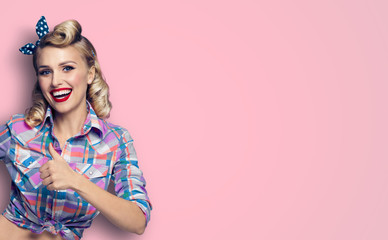 Pin up girl. Excited happy lovely woman showing thumb up gesture or like sign. Retro fashion and...