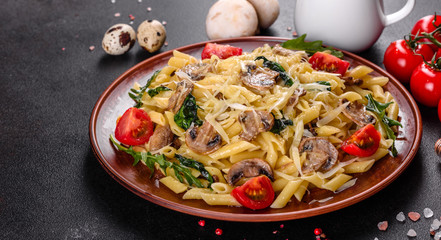 Pasta with mushrooms, cheese, spinach, rukkola and cherry tomatoes