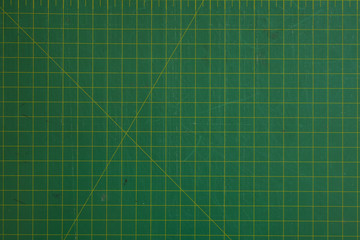 green cutting mat scale with scratch texture from cutter