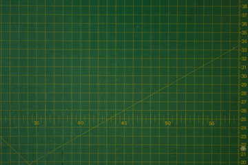 green cutting mat scale with scratch texture from cutter