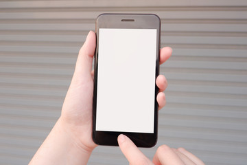Cropped shot view of business human’s hands holding the mobile phone with blank copy space screen for your information content or text message, the woman reading text message on the smart phone.
