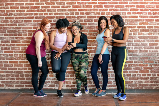 Diverse womens fitness class - Powered by Adobe