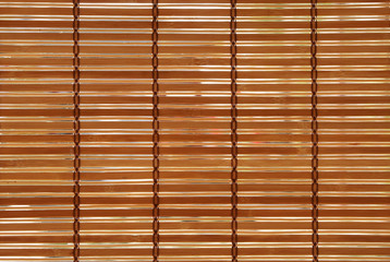 wood bamboo blinds or brown wooden spokes curtain for shade on window for home interior or exterior decor and wallpaper background or backdrop