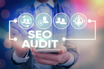 Writing note showing Seo Audit. Business concept for Search Engine Optimization validating and...