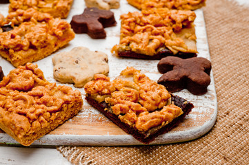 Homemade shortbread cookies lying on a white painted wooden surface. Baking and cooking.