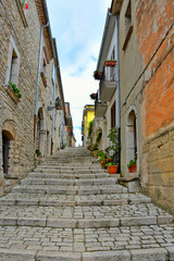 A small road between the old houses of Buonalbergo, a village in the province of Benevento