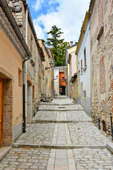 Fototapeta na wymiar A small road between the old houses of Buonalbergo, a village in the province of Benevento