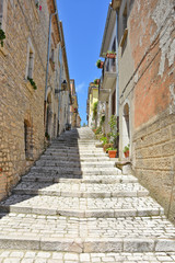 Fototapeta na wymiar A small road between the old houses of Buonalbergo, a village in the province of Benevento