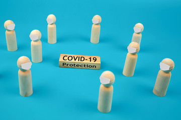 People icons for social distance on wooden toy block.Concepts for health and medical prevention and protect for coronavirus (COVID-19) infection.