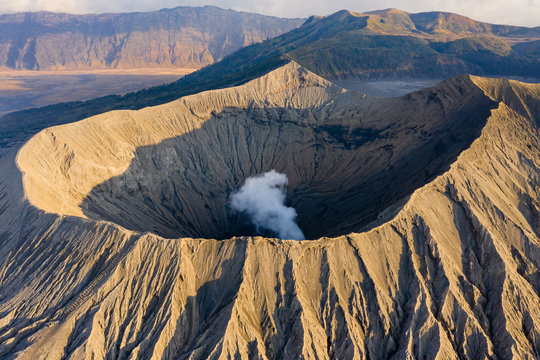 Aerial drone view of steam and volcanic gas venting from the crater of an active volcano (Mount Bromo, Java,Indonesia)