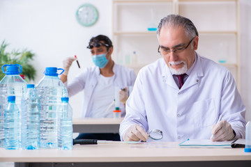 Two chemists working in the lab