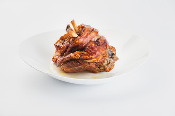 baked pork knuckle on a white background