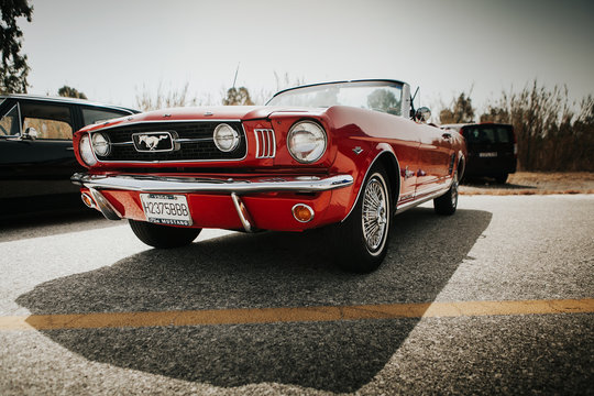 MALAGA, SPAIN - JULY 30, 2016: 1966 Ford Mustang front view in red color, parked in Malaga, Spain.